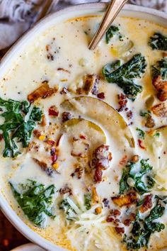 a close up of a bowl of food with broccoli and cheese in it