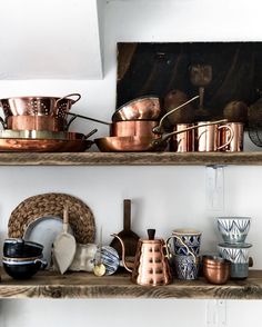 shelves with pots and pans on them