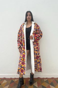 Vintage Banjara tribal fabric, handcrafted by the ancient nomadic tribes of India, has been upcycled into a stunning mirror-embellished winter coat. This unique piece combines rich cultural heritage with modern design, offering both warmth and timeless style. Each vintage tapestry required labour of 1-2 months to finish embroidery by women of Banjara Tribe.   Details: Open duster coat One of a kind piece With sherpa fleece lining inside Care: Dry Clean only Garment Measurements: Clothing is measured while laying flat and unstretched. I highly recommend taking the time to measure something that fits you well for comparison. Remember that you need breathing room that is not included in the measurements. Pls message me for any further queries related to measurement or alterations(downsizing) Fall Festival Outerwear With Boho Collar, Bohemian Floral Embroidered Outerwear For Festivals, Hippie Embroidered Outerwear For Festivals, Long Patchwork Outerwear For Festival, Bohemian Winter Outerwear With Floral Embroidery, Bohemian Floral Embroidered Winter Outerwear, Embroidered Long Outerwear For Festival, Long Embroidered Outerwear For Festival, Bohemian Outerwear With Multicolor Embroidery For Festivals