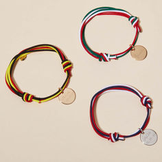 Wave your flag as you wear our Personalized Olympic Bracelet. A colorful way to represent your country, choose three colors of bracelet braid to create your chosen flag of the world. This personalized bracelet can be made even more special with a hand-engraved name, date, or word on the front and reverse of the shiny disc charm.&nbsp;18K Champagne Gold Plated, 925 Sterling Silver or 18K Rose Gold PlatedPastille charm: 0.6” x 0.6”Braid made of durable, colorfast polyesterFully adjustable slid Bracelet Braid, Crystal Dice, Personalised Bracelet, Personalized Bracelet, Grandmother Gifts, Crystal Stars, Sliding Knot, Flags Of The World, Champagne Gold