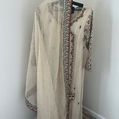 Elegant And Modest Palazzo And Kameez Suit With Dupatta. Shirt Is In Mysoori Fabric With Hand Embroidered Sleeves And Hems. Palazzo Pants Are Jamawar Fabric In Cream And Gold. This Suit Was Only Worn Once And Is Almost Brand New. Purchased From Asma&Shumaila Boutique In San Francisco Ca In November 2023. Festive Full-length Embroidered Dupatta, Traditional Floor-length Unstitched Suit With Dupatta, Long Unstitched Embroidered Anarkali Set, Long Anarkali Set With Intricate Embroidery For Festivals, Unstitched Long Embroidered Anarkali Set, Unstitched Sharara With Resham Embroidery, Unstitched Long Anarkali Set With Embroidery, Long Dupatta With Intricate Embroidery For Diwali, Eid Floor-length Multicolor Embroidered Sets