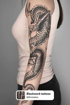 a woman with a dragon tattoo on her arm and shoulder is shown in black ink