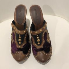 Purple Velvet, Brown And Tan Leather With Gold Studs, Never Worn 100%%% Authentic Brown Closed Toe Clogs With Studded Outsoles, Luxury Brown Clogs With Round Toe, Brown Slip-on Mules With Studded Rubber Outsoles, Brown Slip-on Mules With Studded Outsoles, Brown Closed Toe Mules With Studded Rubber Outsoles, Luxury Brown Closed Toe Clogs, Designer Mules With Wooden Heel And Round Toe, Studded Clogs, Miu Miu Shoes