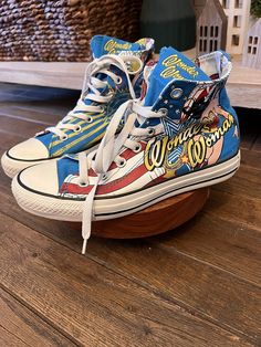 Step into the world of vintage comics with these rare Converse shoes featuring the iconic Wonder Woman character. The vibrant multicolor canvas material and retro design make these sneakers a must-have for any casual occasion. With a slip-on and lace-up closure, they're perfect for those on-the-go moments. The solid pattern and medium shoe width provide a comfortable fit, while the Converse All Star product line ensures top-quality craftsmanship. These shoes are the perfect addition to any sneaker collection and a fun way to show off your love for comics. Wonder Woman Vintage, Rare Converse, Woman Character, Vintage Comics, Sneaker Collection, Converse All Star, Solid Pattern, Converse Shoes, Retro Design