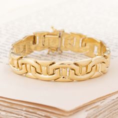 An Italian gold link bracelet with interlocking “T” shaped links - a bold and gold option for your wrist that we totally love. The gold tone on this 18kt yellow gold is so deep and rich, with unique links that join together seamlessly. Perfect for wear on its own, or stacked up with the rest of your favorite bracelets. 18kt yellow gold 15.8dwt in total weight 7” in length Please see qualitative report for more information. Formal Yellow Gold Bracelets With Hook And Links, Gold Link Bracelet With Hook And Links, Formal Gold Chain Bracelet With Hook And Links, Formal Gold Bracelet With Links, Luxury Chain Bracelet With Rectangular Links And Hooks, Luxury Yellow Gold Chain Bracelet With Hooks And Links, Elegant Gold Chain Bracelet With Hooks And Links, Gold Timeless Chain Bracelet With Box Clasp, Classic Gold Bracelets With Hooks And Links