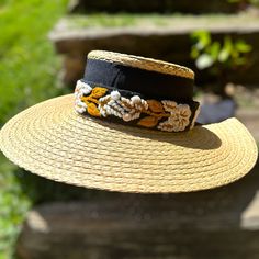 Our Mexican, high quality Artisal Palm Hat, comes with a removable hand embroidered band.  The band is embroidered by Female Artisans of the Andes in Perú.  This classic wide brim hat has sturdy weave to be used in the beach and all adventures in the sun.  Great sun protection.  The close-weave material in this product offers UPF 50+ which blocks 97.50% of the sun's UV rays. Hat Brim measures 4 3/4" wide Crown of hat measures 3 3/4" tall One size Adjustable Toquilla Straw Boater Hat Visor, Adjustable Woven Boater Hat With Short Brim, Embroidered Short Brim Straw Hat For Summer, Handmade Adjustable Sun Hat For Kentucky Derby, Embroidered Flat Brim Summer Hat, Adjustable Toquilla Straw Sun Hat For Garden Party, Adjustable Handwoven Boater Hat For Vacation, Bohemian Adjustable Sun Hat For Garden Party, Bohemian Sun Hat Visor For Summer