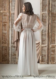 Feminine White Evening Nightgown, Feminine White Nightgown For Evening, Sheer Long Sleeve Wedding Nightgown, Floor-length Wedding Nightgown With Lace Trim, Floor-length Lace Trim Nightgown For Wedding, Elegant Flowy Gown For Wedding Night, Fitted Long Sleeve Wedding Nightgown, Wedding Night Gown With Lace Bodice And Long Sleeves, Elegant Long Sleeve Sheer Nightgown