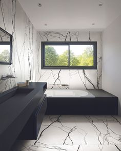 a bathroom with marble flooring and walls