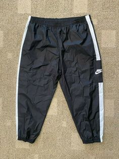 ~ Nike Sportswear ~   Women's Woven Training Pants Style: CJ7346 - Color: 010 Black / White - Size: XXL  ~ Brand New with Tags - Retail $60.00 ~  Standard Fit Elastic waistband  2 side pockets  Elastic in leg hems Waist side to side measures approx. 20.5" no stretch Inseam approx. 27.5" Outseam approx. 39.5" 100% Polyester I want buyers to know that customer satisfaction is my Priority.  If you ever have a problem with your purchase Please contact me and I will do everything I can to resolve the Nike Wind Pants, Sporty Nike Nylon Pants, Nike Black Sportswear Pants, Nike Cotton Pants With Moisture-wicking, Nike Sporty Moisture-wicking Pants, Nike Sportswear Women, Nylon Pants, Training Pants, Woman Weaving