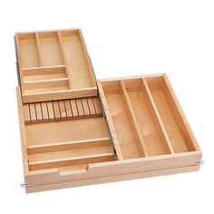 an open wooden box with compartments on the inside