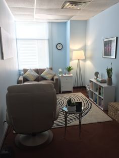 the living room is clean and ready to be used as a den or office space