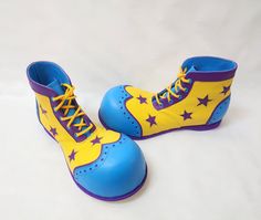 "Clown Shoes with Bubble toe, Wingtip pattern, brogueing and Stars Handcrafted to order in London Genuine leather: upper is made of cowhide leather in Yellow and Blue with Purple trims and Stars  OTHER COLOURS ARE AVAILABLE UPON REQUEST. Full leather lining. The Bubble toe is extended approximately 1.5-2\"inches from the end of the toes, with a width of approx. 5-6\"inches depending on the shoe size. The bubble is formed around the inside shoe that is custom-made to size. The shoes are lightweig Circus Shoes, Jester Shoes, Clowncore Shoes, Cute Clown Shoes, Purple Punk Boots With Round Toe, Clown Shoes, Inside Shoes, Knee High Heels, Faux Leather Boots