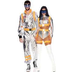 two people dressed in silver and orange are standing next to each other, one is wearing an astronaut suit