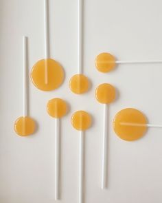 several lollipops are arranged on a white surface