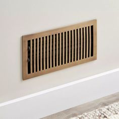 an air vent in the corner of a room