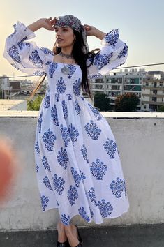 "DESCRIPTION blue boota floral printed long maxi dress / square neckline with smocked summer maxi dress / long sleeve boho maxi dress Indian (Jaipur) Traditional Hand Block Printed Dresses for summer vacations, beaches wear, party wear, and more occasions to wear this dresses. PRODUCT DETAILS: Long sleeve, square neck, Long dress FABRIC: soft and breathable cotton cambric WASH CARE:  wash in cold water, air dry in shade.. SLEEVE LENGTH - 22 inch Size chart is mentioned in images. Size chart is g Printed Square Neck Maxi Dress For Vacation, Printed Square Neck Maxi Dress For Spring, Spring Printed Maxi Dress With Square Neck, Flowy Smock Dress With Square Neck, Bohemian Square Neck Maxi Dress For Vacation, Bohemian Square Neck Maxi Dress For Beach, Bohemian Maxi Dress With Square Neck For Vacation, Bohemian Flowy Maxi Dress With Smocked Cuffs, Flowy Bohemian Maxi Dress With Smocked Cuffs