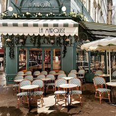 an outdoor cafe with tables and chairs in front of the building that houses la mipquise