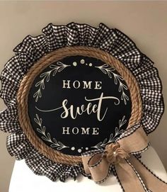 a black and white sign that says home sweet home