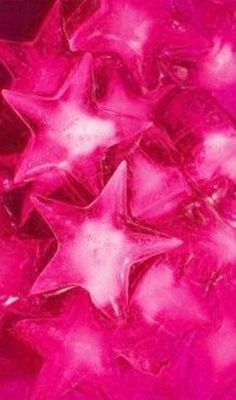 close up view of pink star shaped ice cubes