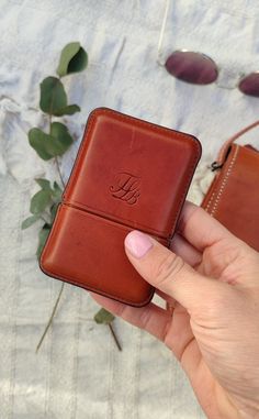 Size: Approx. 4 x 2 1/2 inches 10.5 x 6.5cm It's hard to resist picking a TLB card holder! Sized to carry your ID and credit cards (about 8), the TLB card holder can fit in your pocket or purse with ease - and makes a great gift for any-age. Our handmade small leather goods & accessories are handcrafted using the finest cowhides & durable hardware. Enjoy lasting leather designs like our wallets, card holders, keychains and more. Designed and hand made with love and care in Spain. Please note: it Cognac Rectangular Wallet With Rfid Blocking, Leather Card Holder With Slots As Gift, Cognac Wallet With Interior Card Slots For Gift, Cognac Wallet With Interior Card Slots As Gift, Classic Card Holder With Interior Slots For Gift, Classic Card Holder With Interior Slots As Gift, Rectangular Rfid Blocking Card Holder For Personal Use, Modern Bifold Card Holder For Gift, Rectangular Cognac Wallet Perfect For Gifts