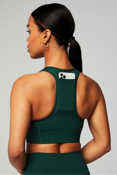 On-The-Go Zip Medium Impact Sports Bra Fabletics green female Activewear >> Womens >> Sports Bras >> Sports Bra >> Medium Impact regular Training External Pockets/Moisture-Wicking/Removable Bra Cups Green Sports Bra With Built-in Padding For Gym, Go-dry Snug Fit Activewear For Training, Snug Fit Functional Yoga Activewear, Green Sports Bra With Built-in Padding For Training, Green Fitted Sporty Activewear, Sporty Snug Fit Activewear, Sporty Snug Fit Sweat Resistant Activewear, Green Sports Bra With Built-in Padding, Green Athleisure Sports Bra With Built-in Padding