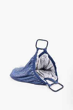 Find us someone who isn’t awed by this bag, and we’ll gladly give you your money back! Designed for the water babies, this Fishnet market tote can do it all from high seas to high fashion! Trust us. You’ll find this bag on your shoulder more often than you would think, just because of how wearable it is and how seamlessly it pairs with most outfits. Be prepared for the compliments every time you wield this bag! A hint of glam sneaks itself in oh so subtly with this one, with the shimmery interio Summer Beach Bag With Reinforced Handles For Shopping, Summer Bags With Mesh Lining For Daily Use, Summer Travel Bags With Mesh Lining, Shopping Tote Shoulder Bag With Mesh Lining, Blue Handwoven Festival Bag, Eco-friendly Open Weave Beach Bag, Eco-friendly Beach Bag With Open Weave, Eco-friendly Blue Bucket Beach Bag, Eco-friendly Blue Handwoven Beach Bag