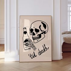 a framed poster with a skull holding a bottle