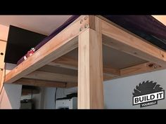 a loft bed is built into the side of a wall with a purple mattress on top