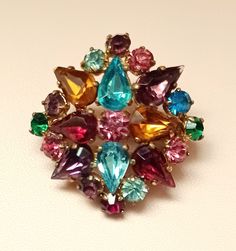 Attractive multicoloured vintage Czech brooch. Signed on rear.  All stones are present and of good quality. A lovely eye-catching brooch, in  good vintage condition, that would grace most outfits. Measures approx. 3.5 x 3.5cm The pin and roll-ball catch are in working on order. Vintage Rhinestone Jewelry, Lovely Eyes, Rhinestone Jewelry, Diamond Shaped, Vintage Rhinestone, Diamond Shapes, Good Quality, Antique Jewelry, Vintage Antiques