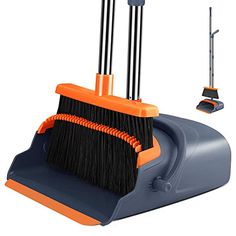 an orange and blue dustpan with two brooms on it