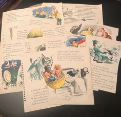 several old children's postcards are laying on a table with some writing in them