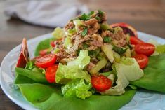 a salad with lettuce and tomatoes on a plate