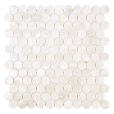 white mother of pearl tile with circles on the bottom and one circle in the middle