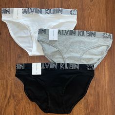 All Nwt This Is A Bundle Of Three Calvin Klein Bikini-Cut Panties. One Black, One Gray, And One White. Calvin Klein Panties, Calvin Klein Black, Womens Calvin Klein, Women's Intimates, Calvin Klein, Black White, Black And White, Women Shopping, White