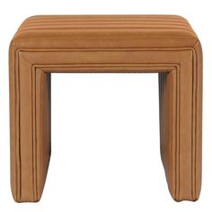 a tan leather stool with four legs and a square shaped design on the top, sitting in front of a white background