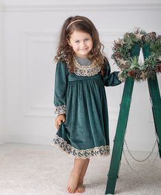 ♡ This is handmade and unique girl dress below knee-length and with long sleeves.  ♡ MADE OF: Green velvet with gold lace. The lining is made of 100% cotton ♡ Processing time: 7-10 business days ♡ CARE INSTRUCTIONS: Wash in cold or warm water (30oC/ 65 - 85F). Do not use bleach. Dry at low temperatures, do not use machine drying. Iron at medium or low temperature. Hand wash and hang dry for longer wear. Vintage Green Winter Dresses, Green Vintage Winter Dress, Gold Long Sleeve Dress For Winter, Gold Long Sleeve Winter Dress, Green Lace Trim Dress For Fall, Green Long Sleeve Christmas Dress, Green Long Sleeve Dress For Holiday, Holiday Green Long Sleeve Dresses, Green Long Sleeve Festive Dress