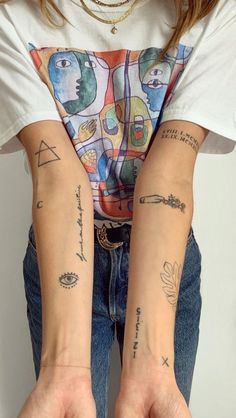 two people with matching tattoos on their arms