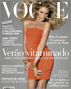 a woman in an orange dress on the cover of a magazine