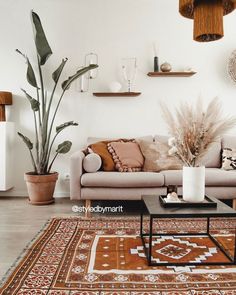 a living room filled with furniture and plants