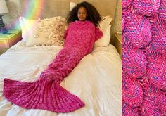 a woman laying on top of a bed next to a pink mermaid tail knitted blanket