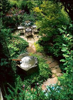 an outdoor garden with tables and chairs