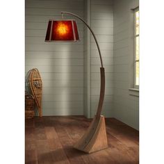 a lamp that is on top of a wooden floor