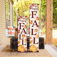 two tall fall decorations sitting on top of a rug