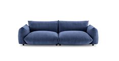 a blue couch sitting on top of a white floor