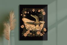 a green wall with a black and gold framed print of a crocodile in a bathtub surrounded by flowers