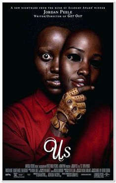 the poster for us shows two women with gloves on their hands and one is wearing a red shirt