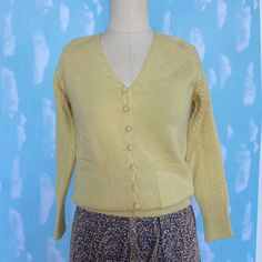 Vintage 1960's Tally Ho Cardigan sweater. Yellow 100% virgin wool hand loomed in the British Crown Colony of Hong Kong. Cable knit shoulders and sleeves. Size Small Bust 30", waist 24", length 22". Very good condition.  I am listing a lot of Vintage 1940-80's clothing the next couple of weeks so please favorite my new shop and check back often. I am also on Instagram as Wonderboutique413. I try to describe as accurately as possible and Vintage sizes have nothing to do with Modern ones so please Vintage Mustard Sweater For Winter, Vintage Mustard Sweater For Fall, Vintage Cardigan For Winter, Vintage Solid Color Winter Cardigan, Vintage Mustard Long Sleeve Sweater, Vintage Long Sleeve Mustard Sweater, Mustard Vintage Long Sleeve Sweater, Vintage Cream Cable Knit Cardigan, Vintage Wool Cable Knit Cardigan