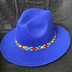 Price Is Firm! Beautiful Hand Beaded Unisex Fedora. Adjustable String Inside Enables Hat To Be Adjusted To Fit Most Heads. Adjustable Multicolor Beaded Hats, Multicolor Beaded Short Brim Hat, Bohemian Blue Beaded Hat, Adjustable Blue Beaded Hat, Adjustable Beaded Blue Hat, Blue Bohemian Beaded Hat, Adjustable Beaded Wide-brim Fedora, Southwestern Blue Beaded Hat Band, Beading Art