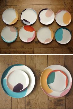 several plates with different designs on them sitting on a wooden floor next to each other