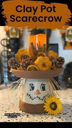 clay pot scarecrow with sunflowers and pine cones